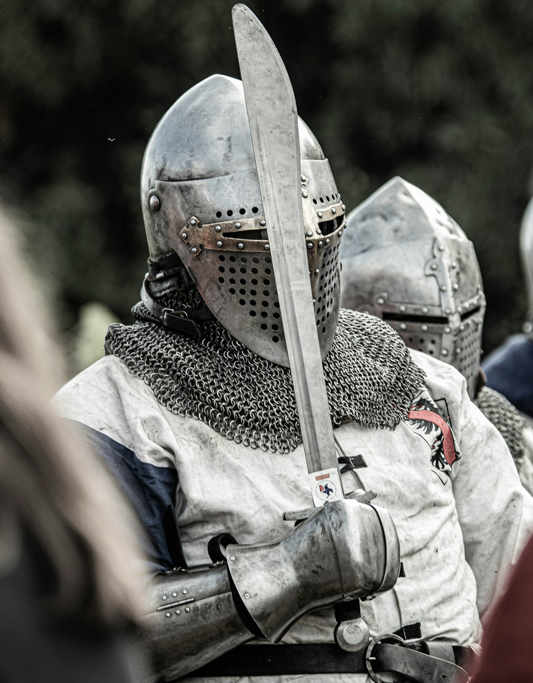 a group of men in medieval armor standing next to each other