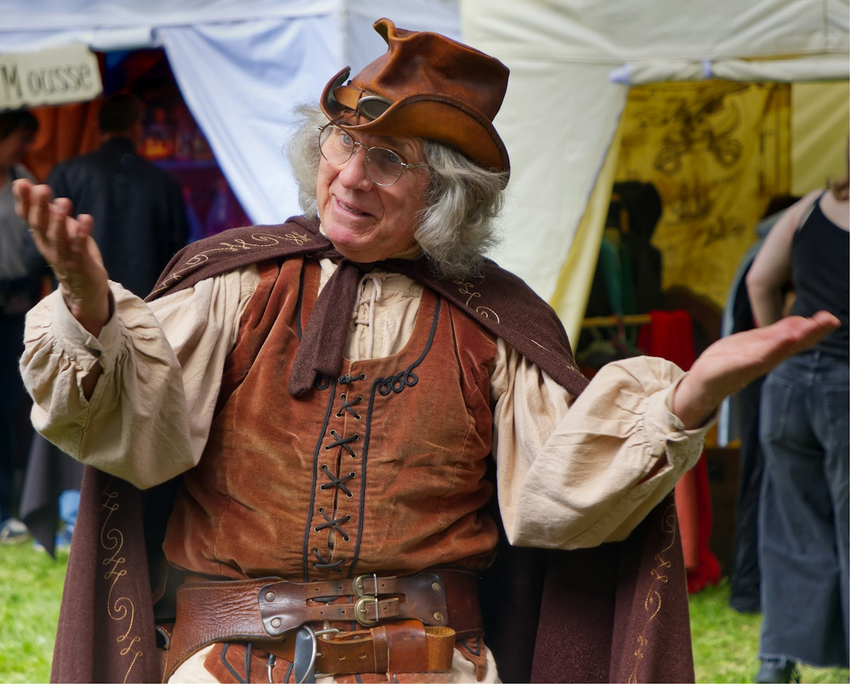 A man in medieval costume is talking.